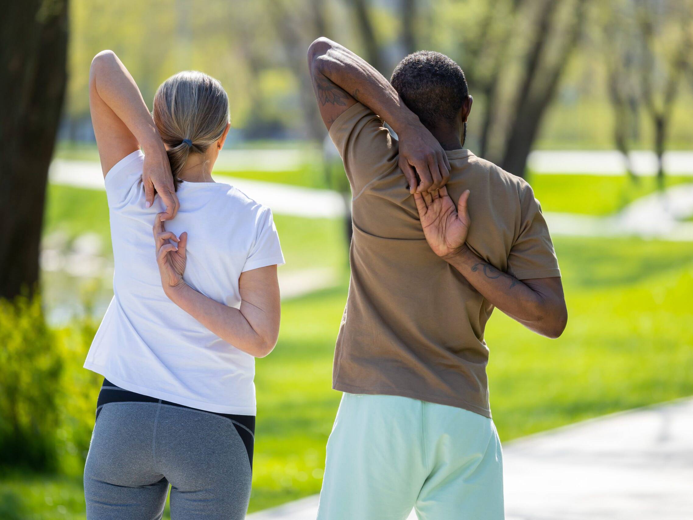 Couple exercising in the park and looking energetic